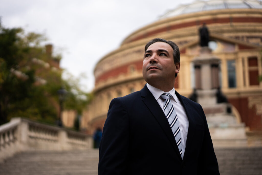 Lifestyle and brand photography showing a smart businessman stood outside the Royal Albert Hall in London